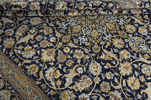 Close-up detail of 2000s Kashan rug from Iran / Persia showing Wool weave
