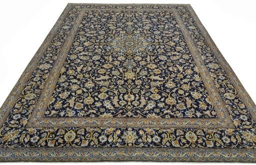 Surface texture of 2000s Kashan rug with natural Wool and intricate pattern