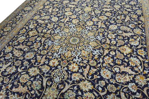 Backside of handmade 2000s Kashan rug showing knot structure and weave density