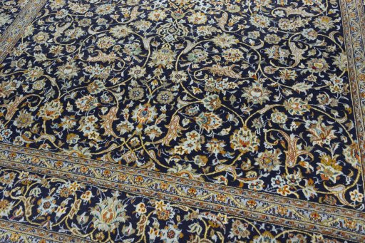 Close-up detail of 2000s Kashan rug from Iran / Persia showing Wool weave