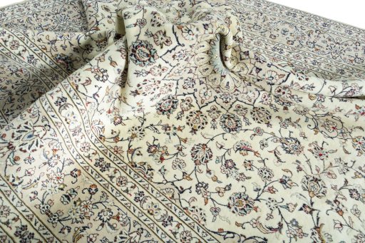 Surface texture of 2000s Kashan rug with natural Cork and intricate pattern