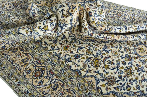 Surface texture of 2000s Kashan rug with natural Wool and intricate pattern