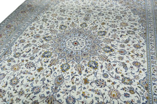 Backside of handmade 2000s Kashan rug showing knot structure and weave density