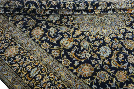 Close-up detail of 2000s Kashan rug from Iran / Persia showing Wool weave