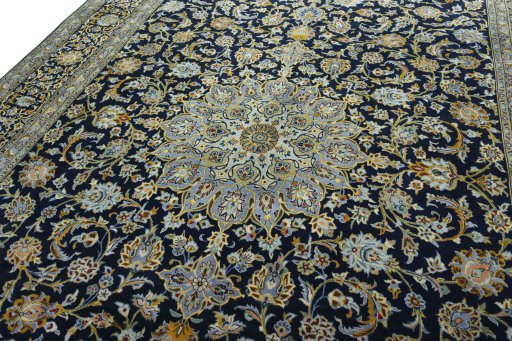 Backside of handmade 2000s Kashan rug showing knot structure and weave density