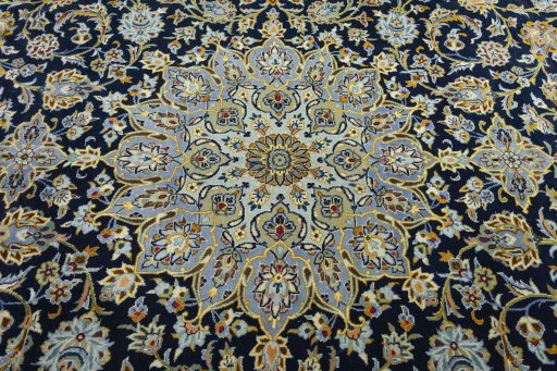 Central medallion detail of 2000s Kashan rug from Iran / Persia
