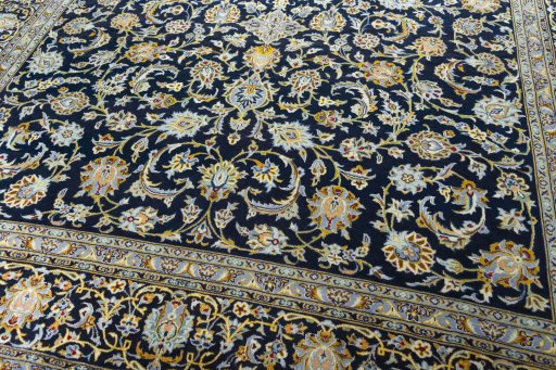Close-up detail of 2000s Kashan rug from Iran / Persia showing Wool weave