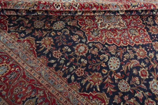 Close-up detail of 2000s Kashan rug from Iran / Persia showing Wool weave
