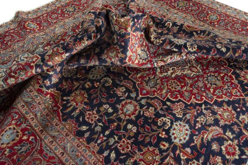 Surface texture of 2000s Kashan rug with natural Wool and intricate pattern