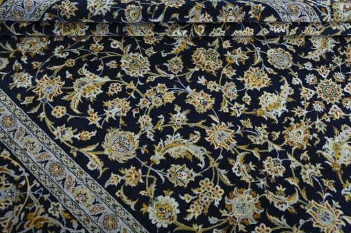 Corner detail of 2000s Kashan rug showing border pattern and Wool pile