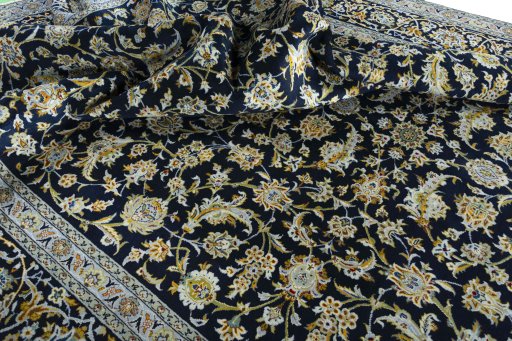 Close-up detail of 2000s Kashan rug from Iran / Persia showing Wool weave