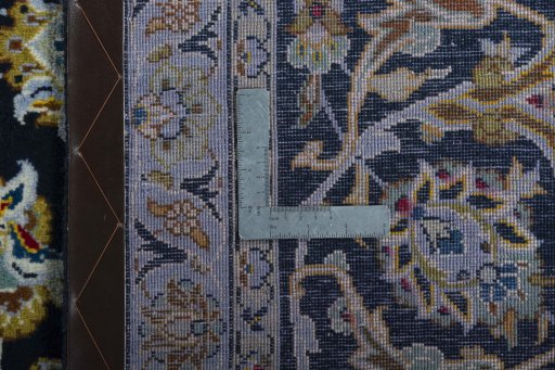 Surface texture of 2000s Kashan rug with natural Wool and intricate pattern