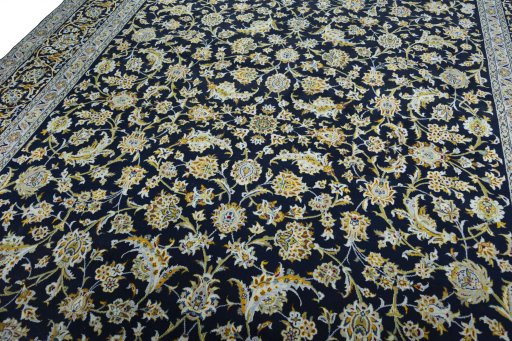 Backside of handmade 2000s Kashan rug showing knot structure and weave density