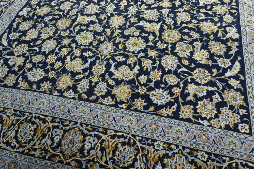 Close-up detail of 2000s Kashan rug from Iran / Persia showing Wool weave