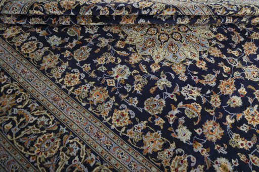Close-up detail of 2000s Kashan rug from Iran / Persia showing Wool weave
