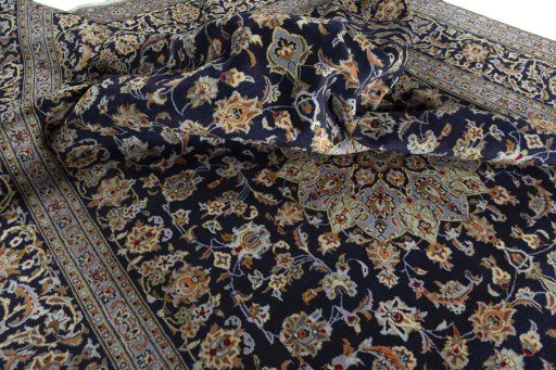 Surface texture of 2000s Kashan rug with natural Wool and intricate pattern