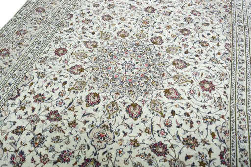 Backside of handmade 2000s Kashan rug showing knot structure and weave density