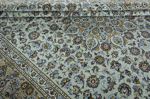 Close-up detail of 2000s Kashan rug from Iran / Persia showing Wool weave
