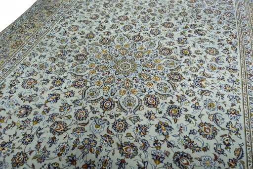 Backside of handmade 2000s Kashan rug showing knot structure and weave density