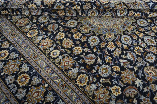 Close-up detail of 2000s Kashan rug from Iran / Persia showing Wool weave