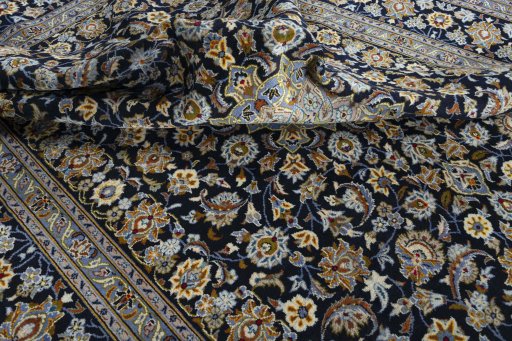 Surface texture of 2000s Kashan rug with natural Wool and intricate pattern