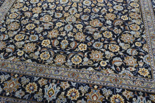 Close-up detail of 2000s Kashan rug from Iran / Persia showing Wool weave