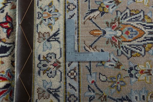 Backside of handmade 2000s Kashan rug showing knot structure and weave density