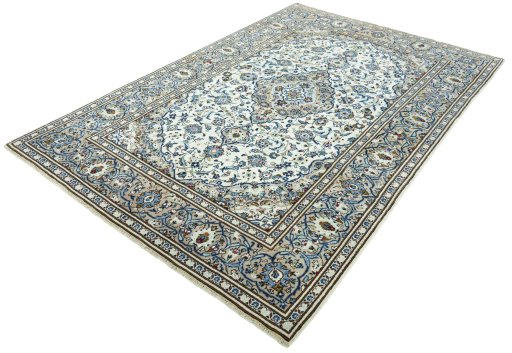 Corner detail of 2000s Kashan rug showing border pattern and Wool pile