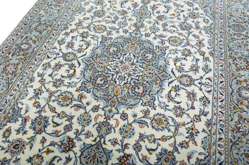 Backside of handmade 2000s Kashan rug showing knot structure and weave density