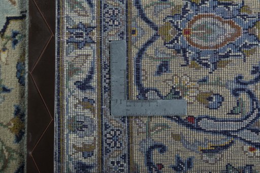 Backside of handmade 2000s Kashan rug showing knot structure and weave density