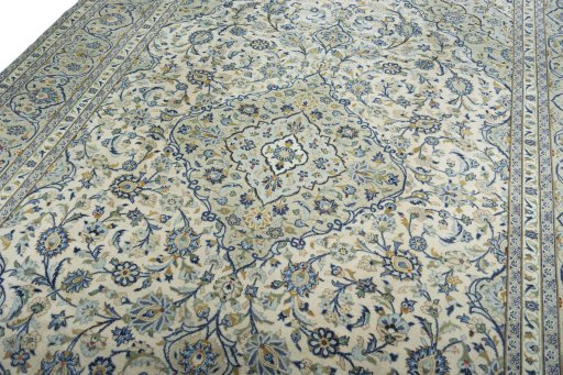 Backside of handmade 2000s Kashan rug showing knot structure and weave density