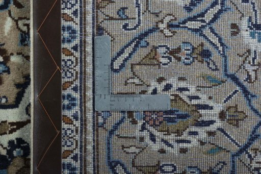 Backside of handmade 2000s Kashan rug showing knot structure and weave density