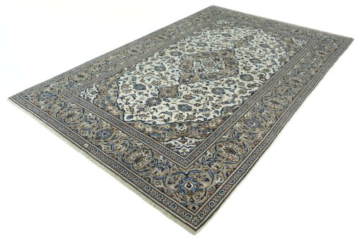 Corner detail of 2000s Kashan rug showing border pattern and Wool pile