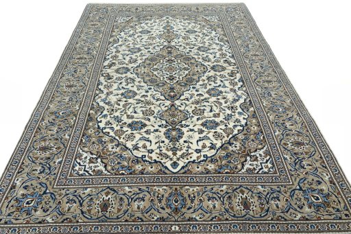 Surface texture of 2000s Kashan rug with natural Wool and intricate pattern