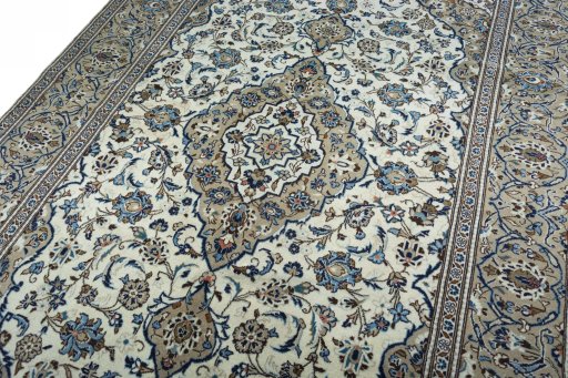 Backside of handmade 2000s Kashan rug showing knot structure and weave density