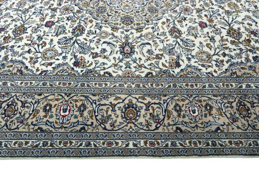 Corner detail of 2000s Kashan rug showing border pattern and Wool pile