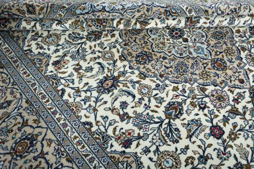 Close-up detail of 2000s Kashan rug from Iran / Persia showing Wool weave