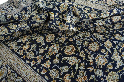 Surface texture of 2000s Kashan rug with natural Wool and intricate pattern