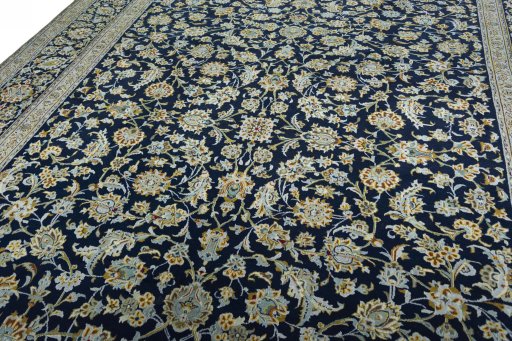 Backside of handmade 2000s Kashan rug showing knot structure and weave density