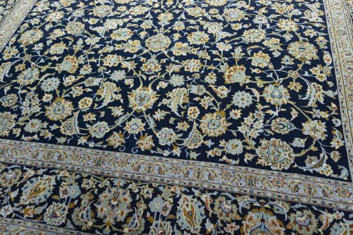 Close-up detail of 2000s Kashan rug from Iran / Persia showing Wool weave