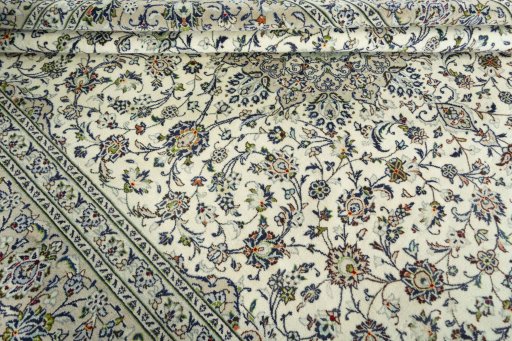 Close-up detail of 2000s Kashan rug from Iran / Persia showing Wool weave