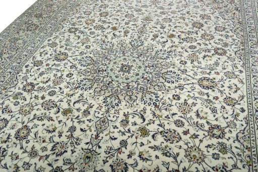 Backside of handmade 2000s Kashan rug showing knot structure and weave density