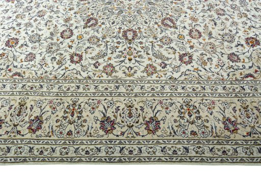 Corner detail of 2000s Kashan rug showing border pattern and Wool pile