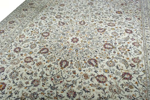 Backside of handmade 2000s Kashan rug showing knot structure and weave density