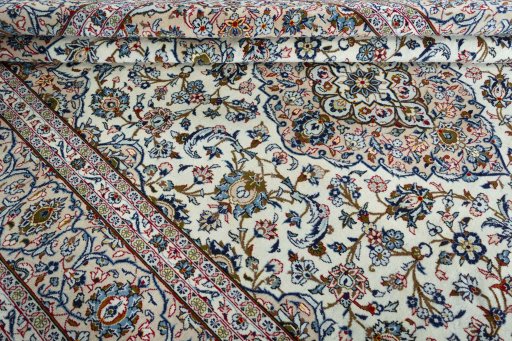 Close-up detail of 2000s Kashan rug from Iran / Persia showing Wool weave