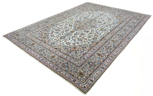 Corner detail of 2000s Kashan rug showing border pattern and Wool pile