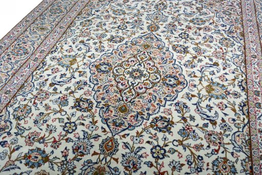 Backside of handmade 2000s Kashan rug showing knot structure and weave density