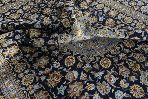 Surface texture of 2000s Kashan rug with natural Wool and intricate pattern