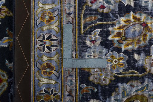 Backside of handmade 2000s Kashan rug showing knot structure and weave density
