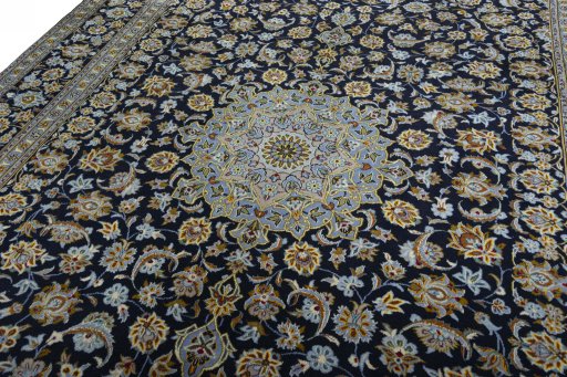 Backside of handmade 2000s Kashan rug showing knot structure and weave density